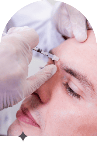A young man gets Botox injected into his forehead