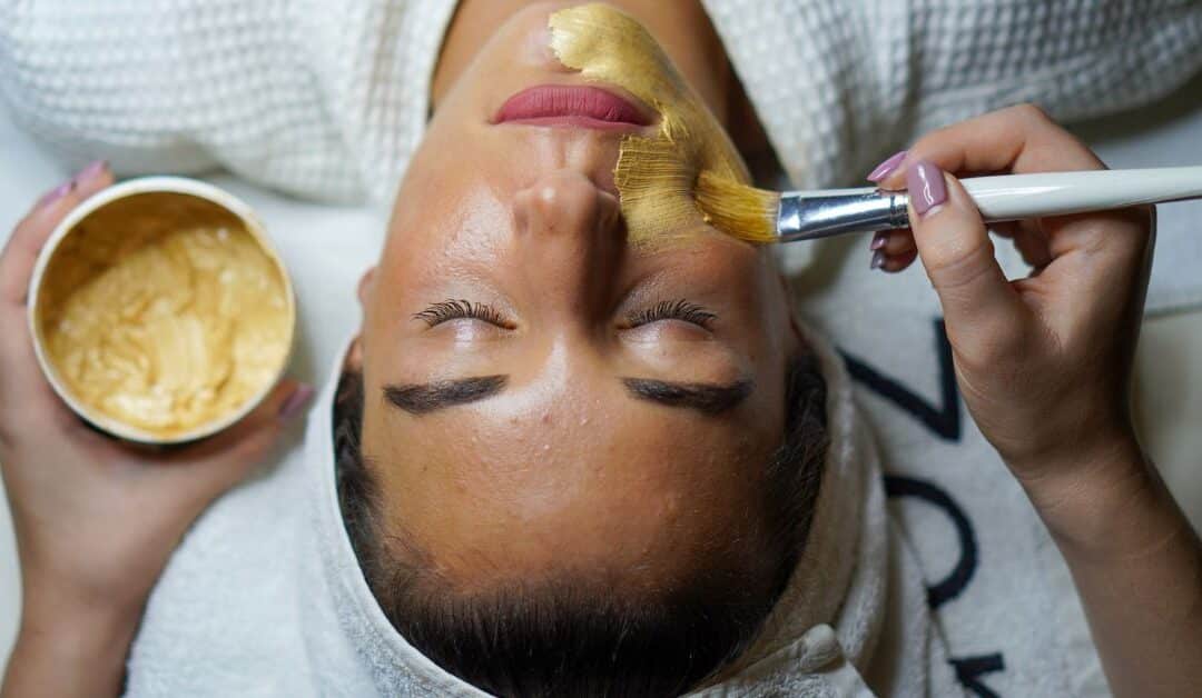 A woman receives a facial at a med spa