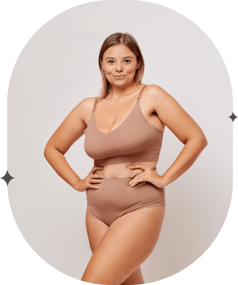 Woman in nude underwear and bra set stands proudly showing off her body after weight loss and weight management efforts, SLC