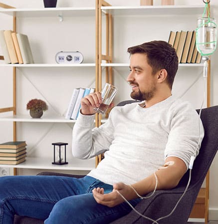 Man receives IV therapy in a calm setting